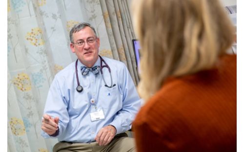 Patient talking with doctor at appointment