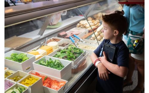 Child at cafeteria counter