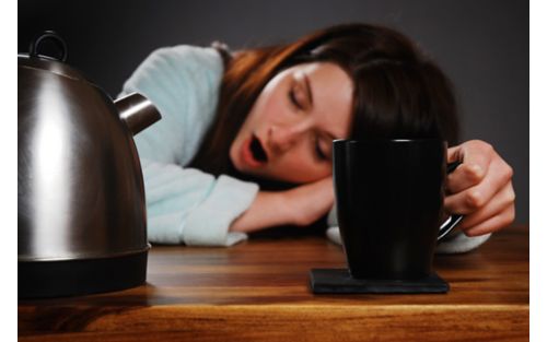 woman with head on desk