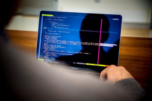 Person looking at code on a computer