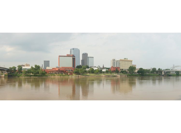 View of Riverfront Park from across the Mississippi River with downtown Little Rock in the distance.