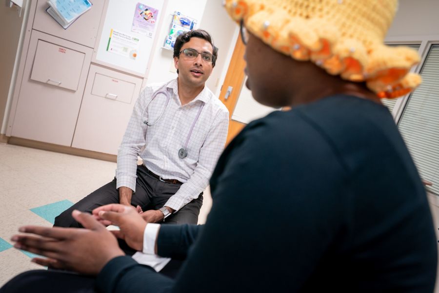 Dr. Akshay Sharma with female patient