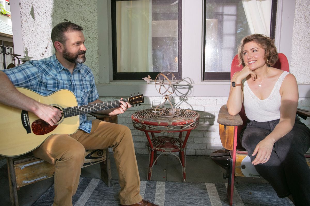 photo of Sarah Strain and her husband on their porch