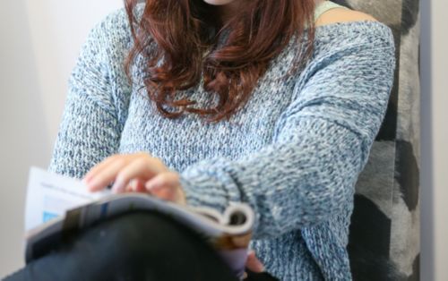 A young lady reading a book.