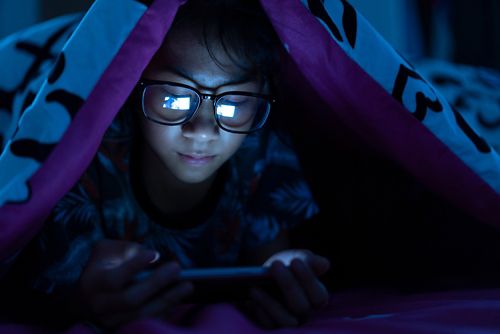 The blue light from phones, TV, and other electronic devices can interfere with sleep.