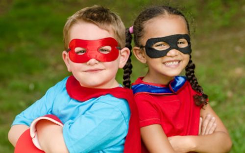 Two children dressed up as superheroes