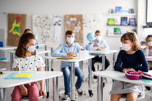 Masks are still recommended in schools for anyone who isn’t vaccinated. At least 3 feet of distance inside the classroom is also recommended.