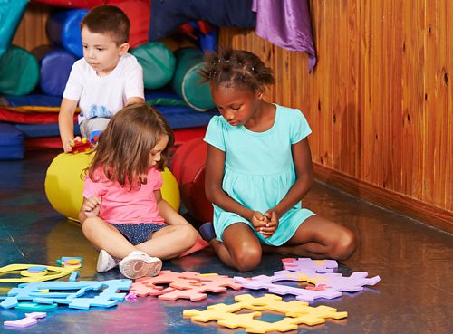 children playing in a playroom together