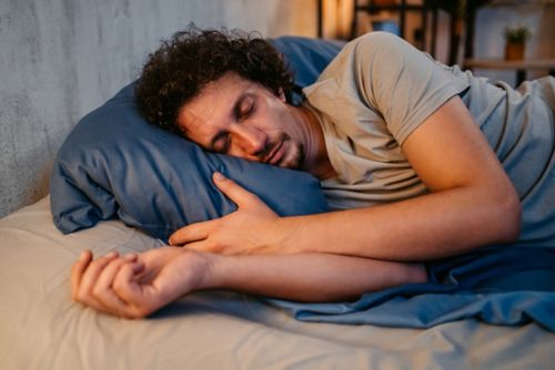 Man sleeping in bed