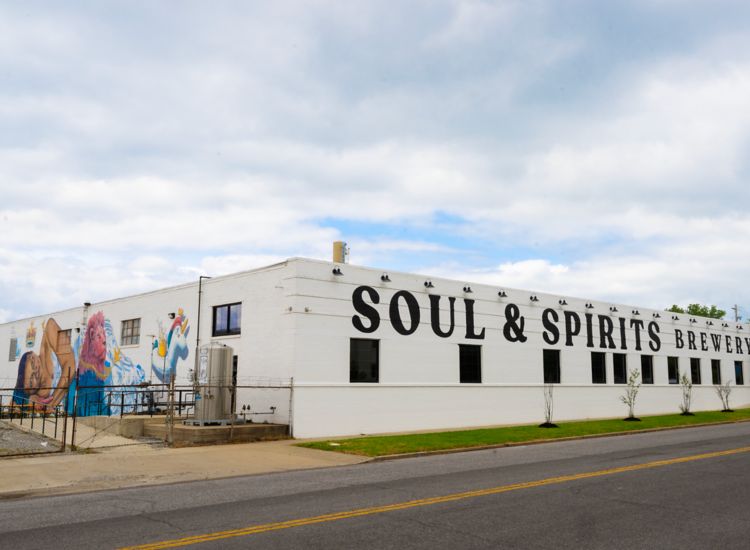 Exterior of a building with Soul and Spirits Brewery in big letters on the wall.
