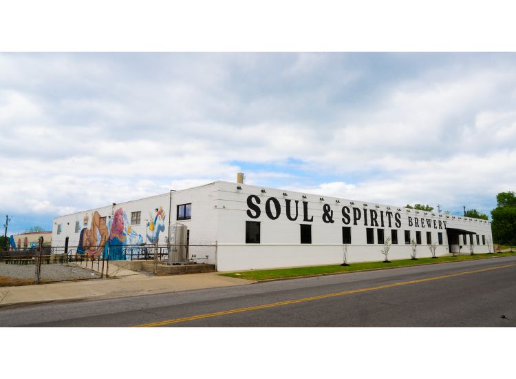 Exterior of a building with Soul and Spirits Brewery in big letters on the wall.