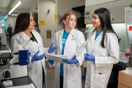 3 women in lab coats