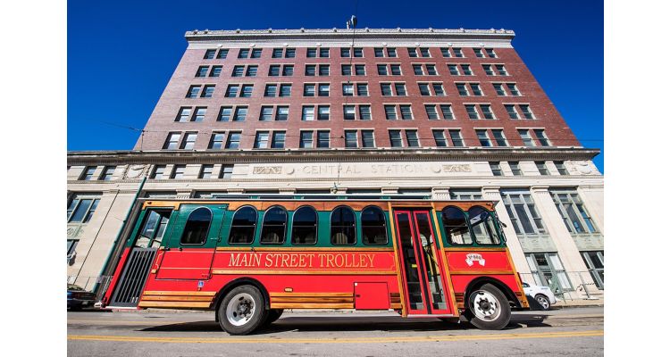 Red and Green Main Street Trolley stopped in front of the Grand Central Hotel in downtown Memphis.