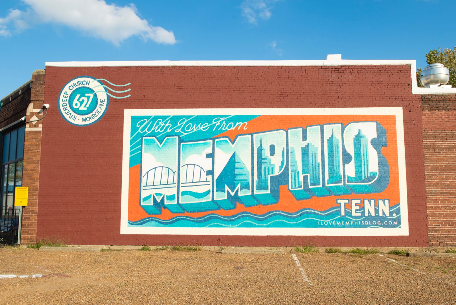 image of riverdeep church with mural of memphis tenn postcard on building