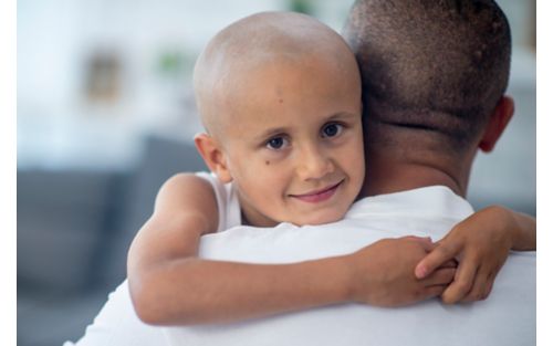 Female child patient hugging father