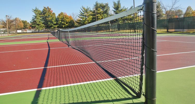 Tennis court in autumn with long depth of field.