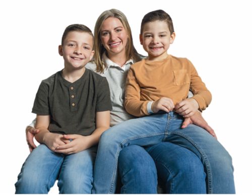mother with two songs sitting on her lap