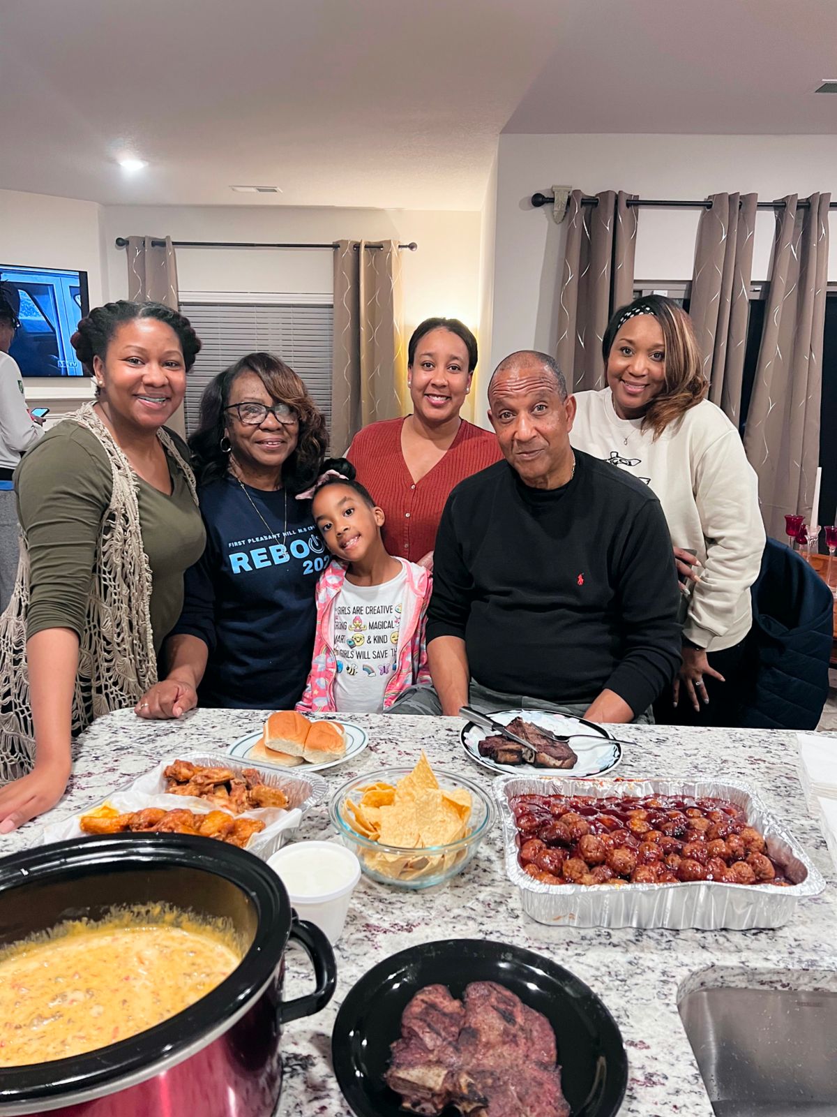 Family around table of food