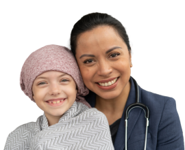 A woman and child in a hat facing forward and smiling
