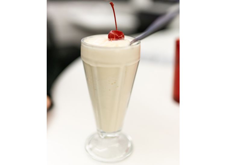 photo of milkshake with cherry on top