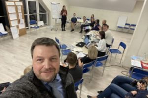 Marcin Wlodarski at Unicorn Clinic staff meeting