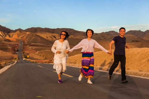 Yike with her family outside on a road