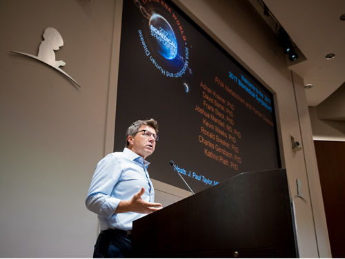 J. Paull Taylor speaking at a podium