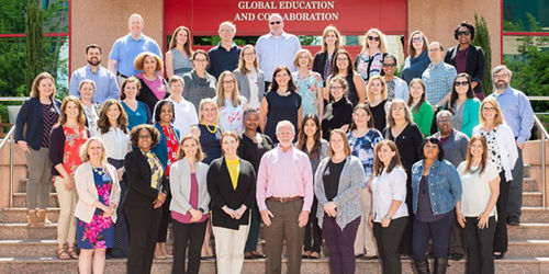 big group of people posing for photo