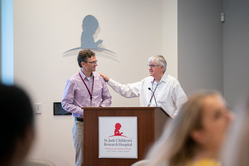 Dean White welcomes Charles Mullighan as the keynote speaker.