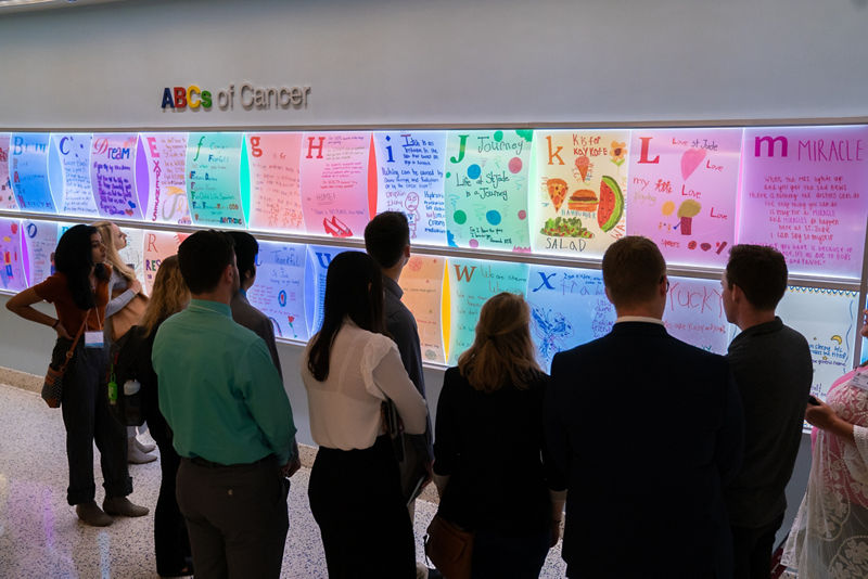 Taking a break at the ABC wall to see cancer from a patient’s perspective.