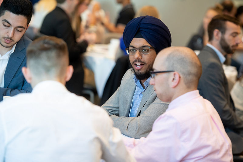 Amrik Kang (University of California) shares a story with fellow participants.