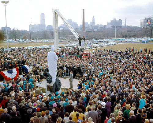 image of crowd of people surrounding a statue of St. Jude that has just been unveiled.