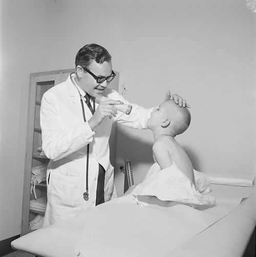 black and white photo of doctor with patient