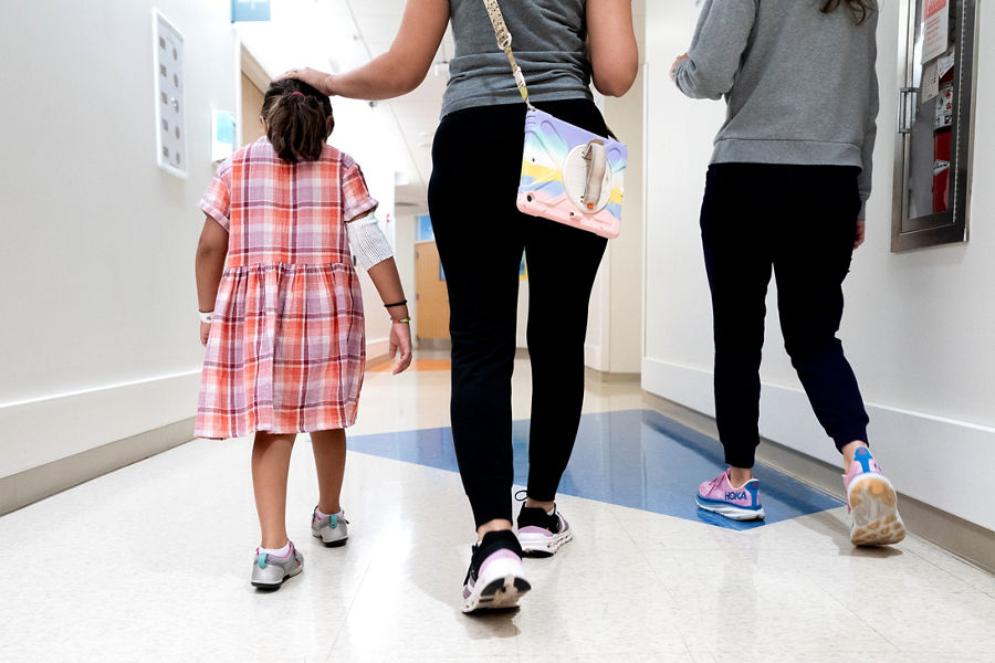 A patient family walks through Family Commons