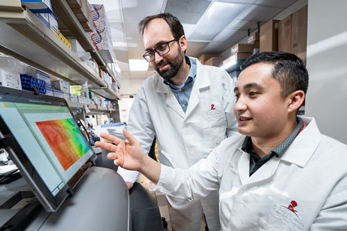 Dr. Jeffery Klco and Dr. Juan Martin Barajas in a lab research setting