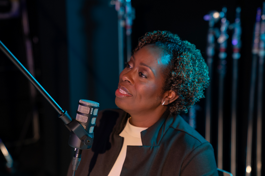Woman speaking into microphone
