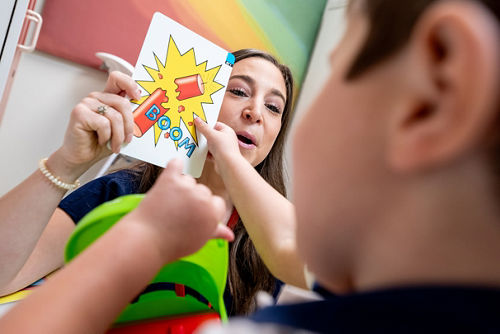 A speech language pathologist with a child patient