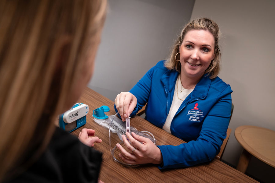 Clinicial nutrition staff member with a patient
