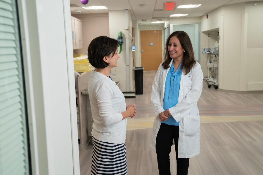 two doctors discussing transplant and cell therapy