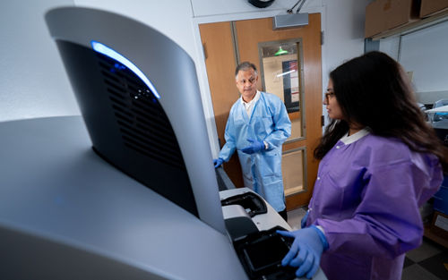 Seba Mahapatra, PhD, and Meena Kumbaji at work in the Clinical Biomarkers Laboratory at St. Jude.  