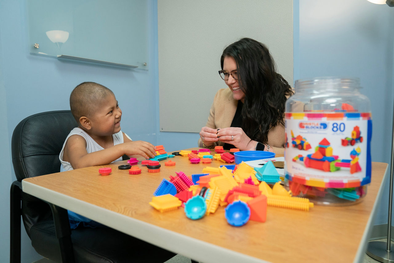 Woman and child playing with blocks