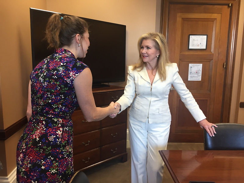 Two women shaking hands