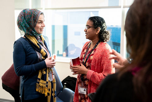 photo of two women talking