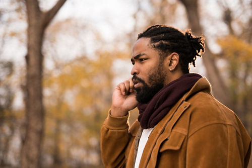 Man talking on cellphone while outdoors