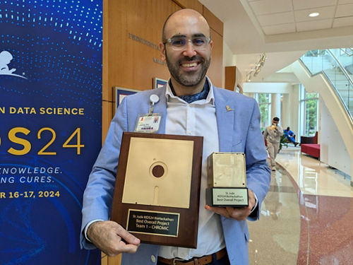 Louis El Khoury with award and plaque