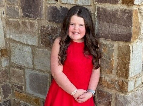 Mattie in a red dress