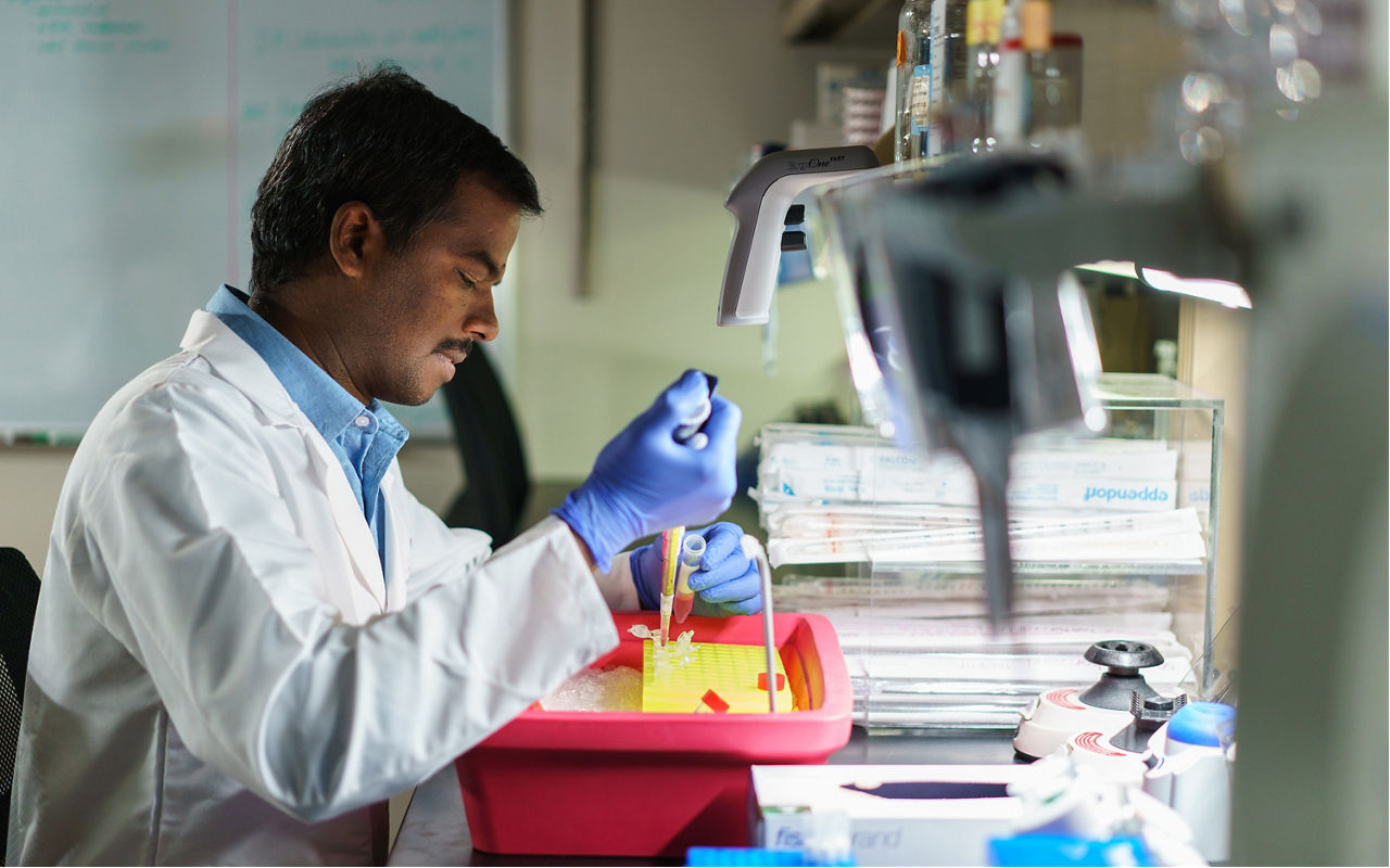 Photo of scientist in lab working