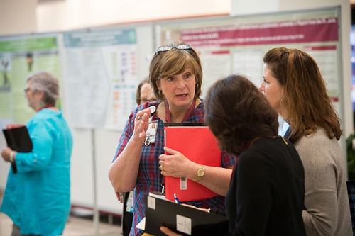 Debra Shipley of St. Jude Nursing speaks with attendees at the annual Patience Care Services Symposium.