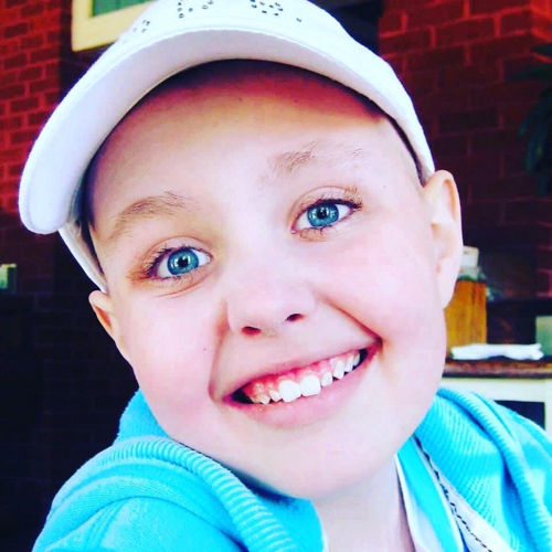 Sydney in baseball cap