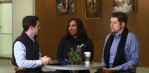 2 men and a woman talking